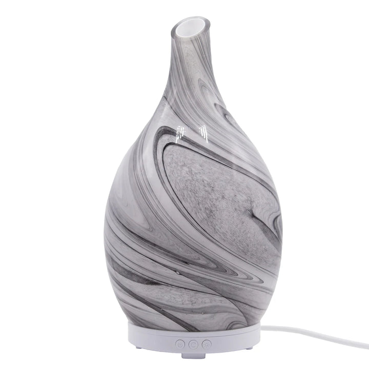 Elegant marble-effect glass electric diffuser with grey and white design. 