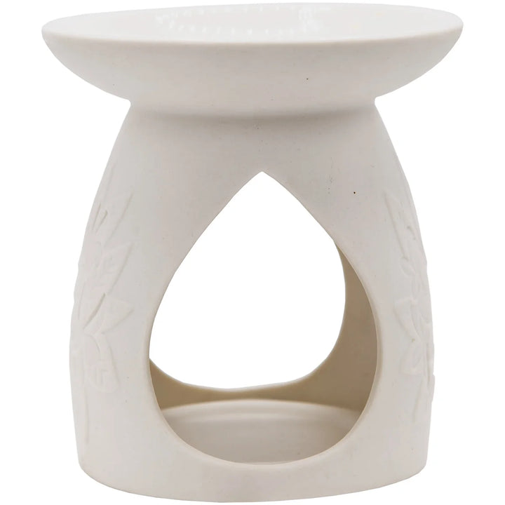 White ceramic wax warmer with delicate floral design. 