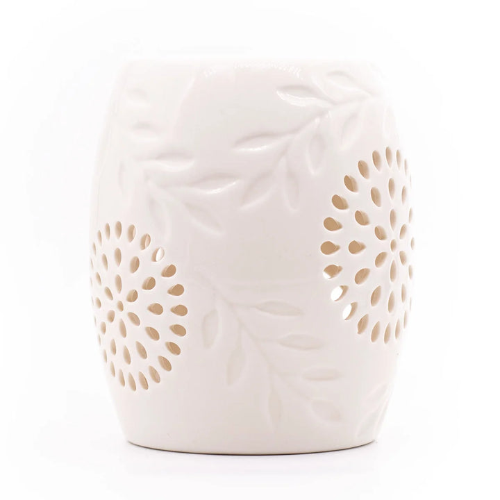 White ceramic wax warmer with delicate leaves design.