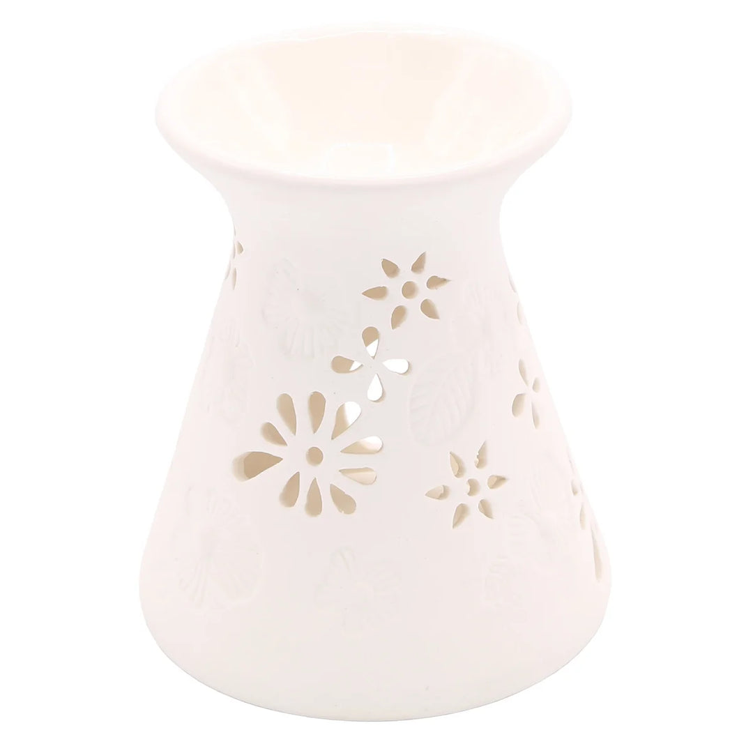White ceramic wax warmer with delicate floral and leaf cut-out design.