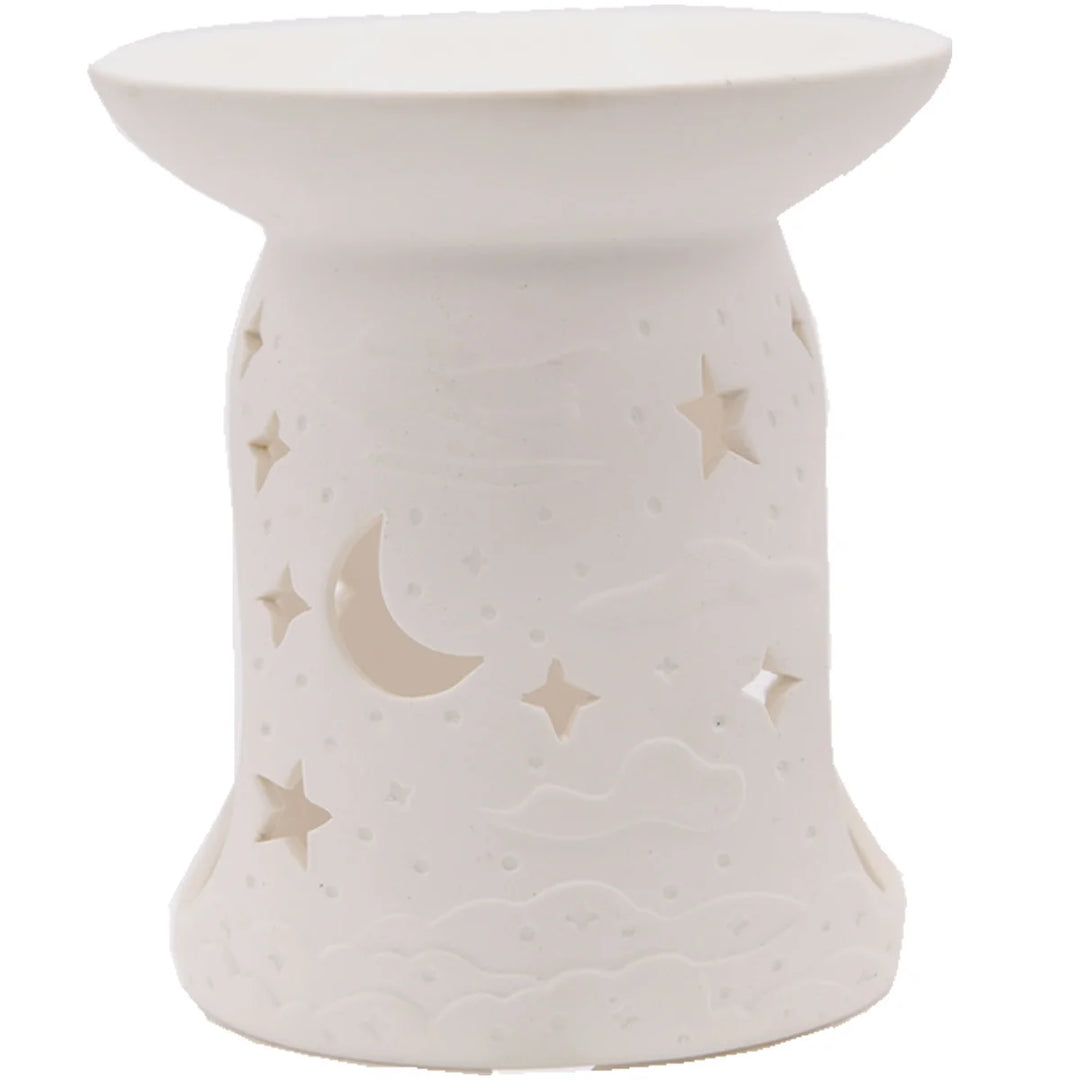 White ceramic wax warmer with delicate stars design. 