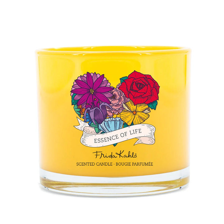 Frida Kahlo Essence of Life scented candle. Bright yellow glass candle featuring a colorful floral design and elegant Frida Kahlo branding on the front.