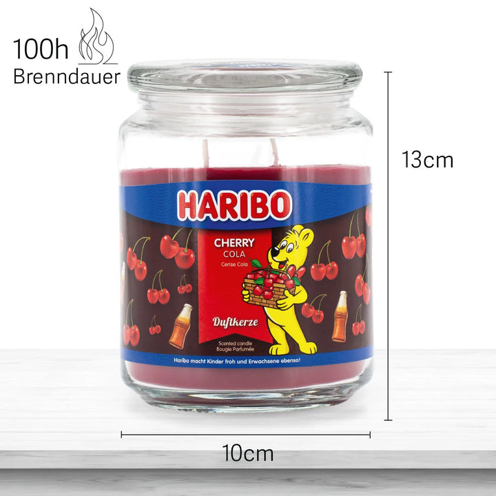 Haribo Cherry Cola Scented Candle in glass jar with lit wick, red wax and cherries and cola design label