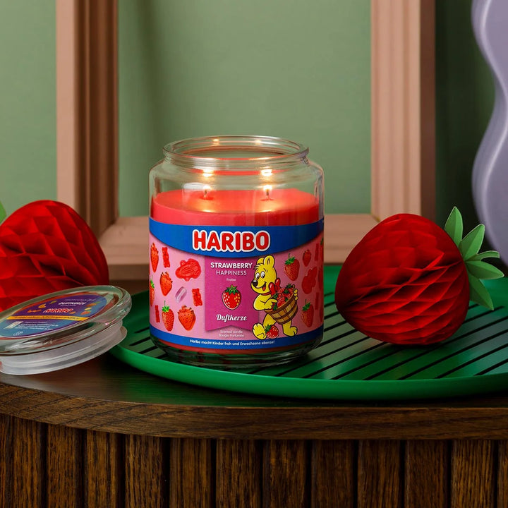 HARIBO Strawberry Happiness scented candle – red jar candle decorated with strawberries and the cheerful HARIBO bear design.