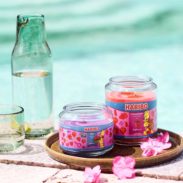 HARIBO Strawberry Happiness scented candle – red jar candle decorated with strawberries and the cheerful HARIBO bear design.