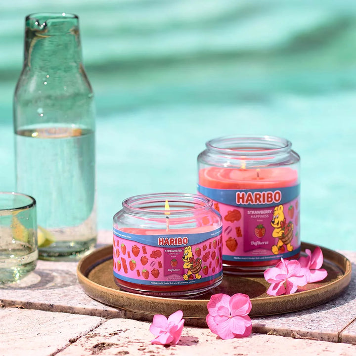 HARIBO Strawberry Happiness scented candle – red jar candle decorated with strawberries and the cheerful HARIBO bear design.