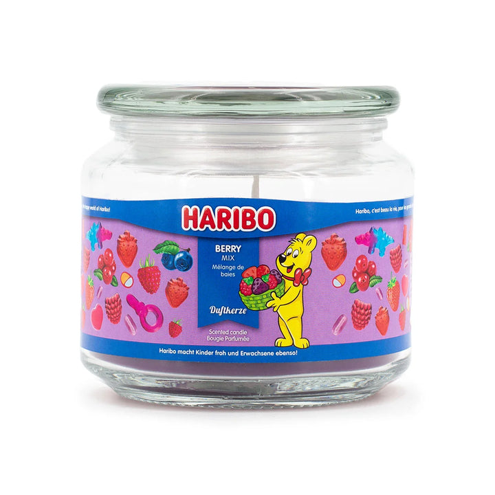 Haribo Berry Mix Scented Candle in glass jar with lit wick, purple wax and berries design label