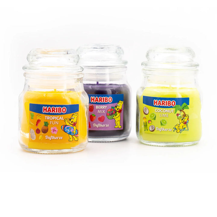 HARIBO Fruit Power scented candle set – colorful gift box with three scented candles: Tropical Fun, Berry Mix, and Coconut Lime, featuring fruity fragrances and the cheerful HARIBO bear design.