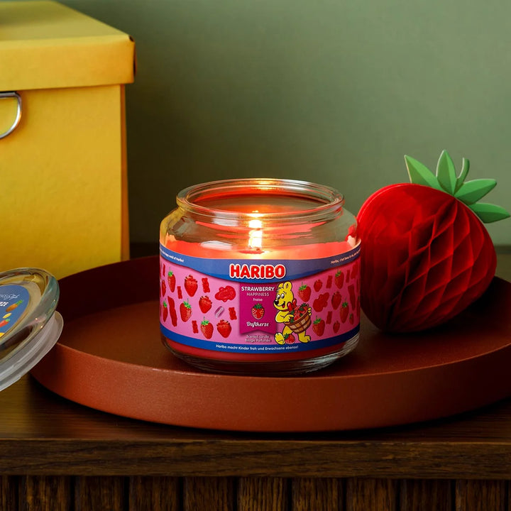 HARIBO Strawberry Happiness scented candle – red jar candle decorated with strawberries and the cheerful HARIBO bear design.