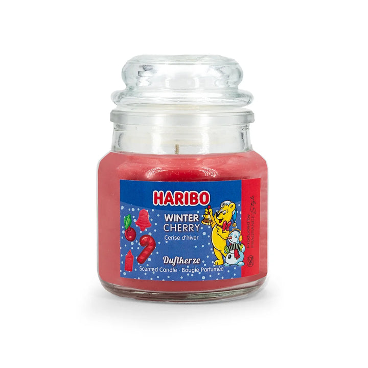 HARIBO Winter Cherry scented candle – red jar candle with a sweet cherry fragrance, festive blue label featuring the HARIBO bear and winter-themed design.