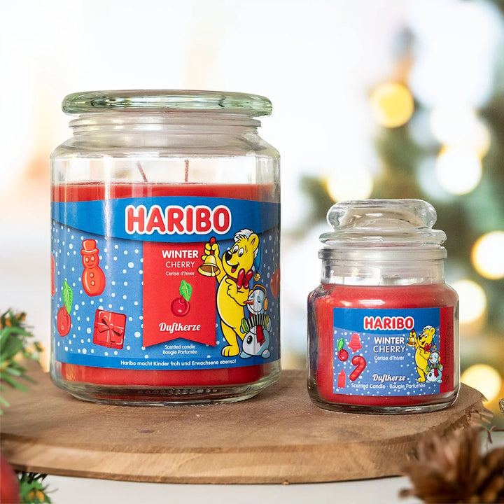 HARIBO Winter Cherry scented candle – red jar candle with a sweet cherry fragrance, festive blue label featuring the HARIBO bear and winter-themed design.