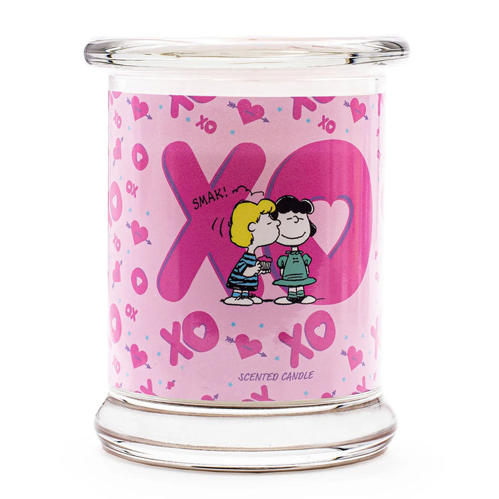 Peanuts XOXO Scented Candle  in glass jar with cotton wick and pink design label 
