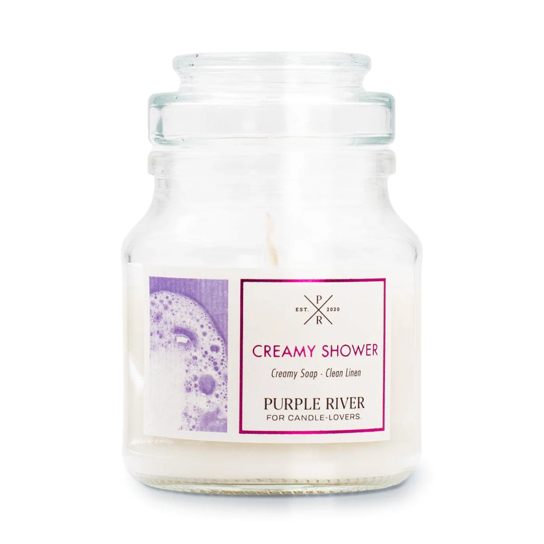 Creamy Shower Scented Candle in glass jar with cotton wick and white wax